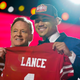 North Dakota State quarterback Trey Lance, right, holds a jersey with NFL Commissioner Roger Goodell after being chosen by the San Francisco 49ers with the third pick in the first round of the NFL football draft Thursday, April 29, 2021, in Cleveland.